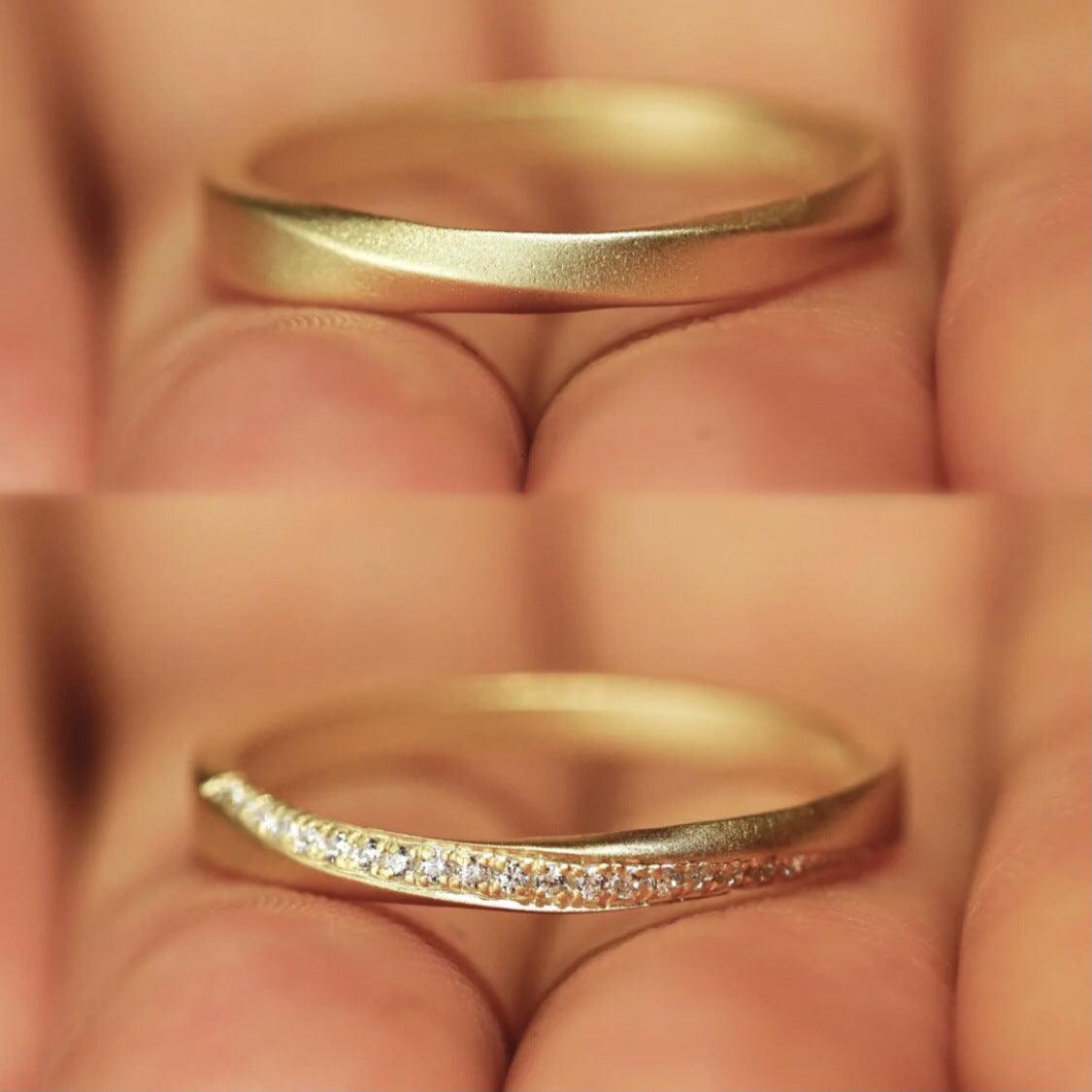 Minimalist gold ring with a delicate curve, embodying timeless elegance.