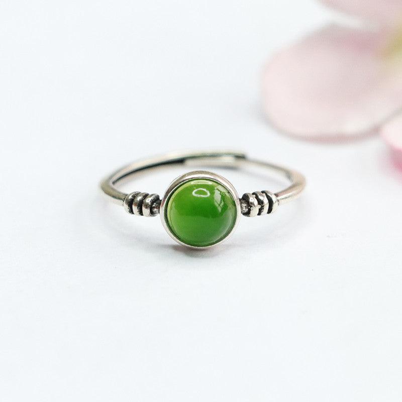 Minimalist green jade ring, handcrafted in sterling silver for an elegant finish.