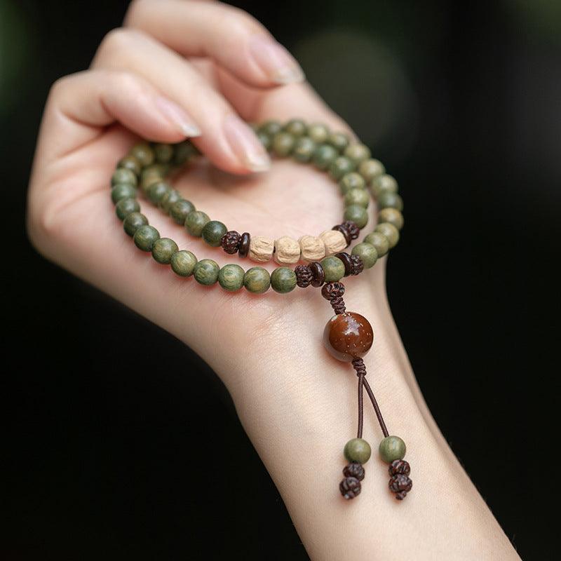 Natural wood mala bracelet with a grounding, earthy aesthetic for spiritual balance.
