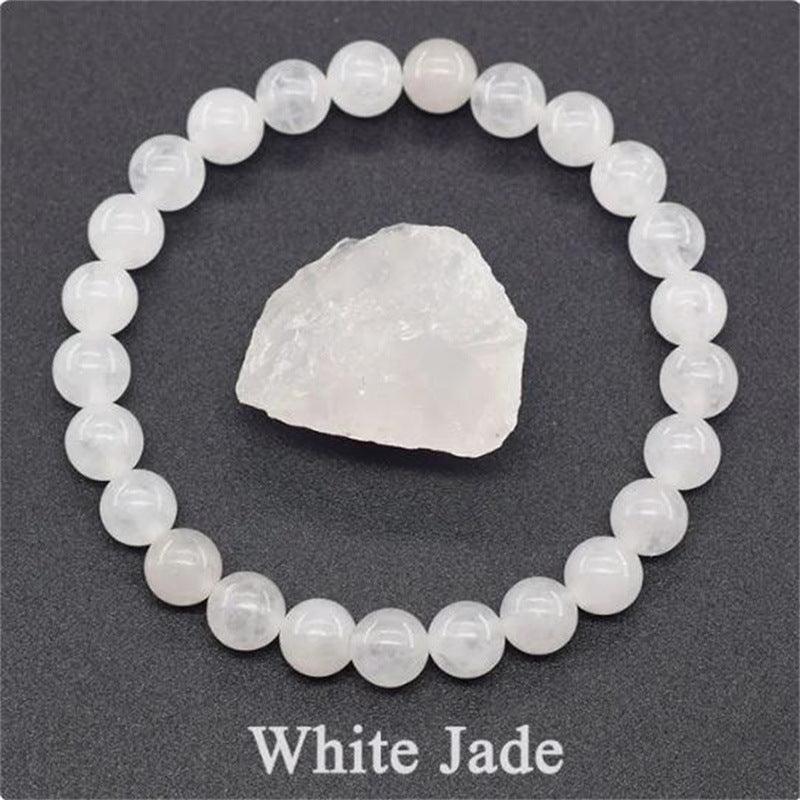 Close-up view of the White Jade bracelet, showcasing the gentle white hues that signify purity and protection.