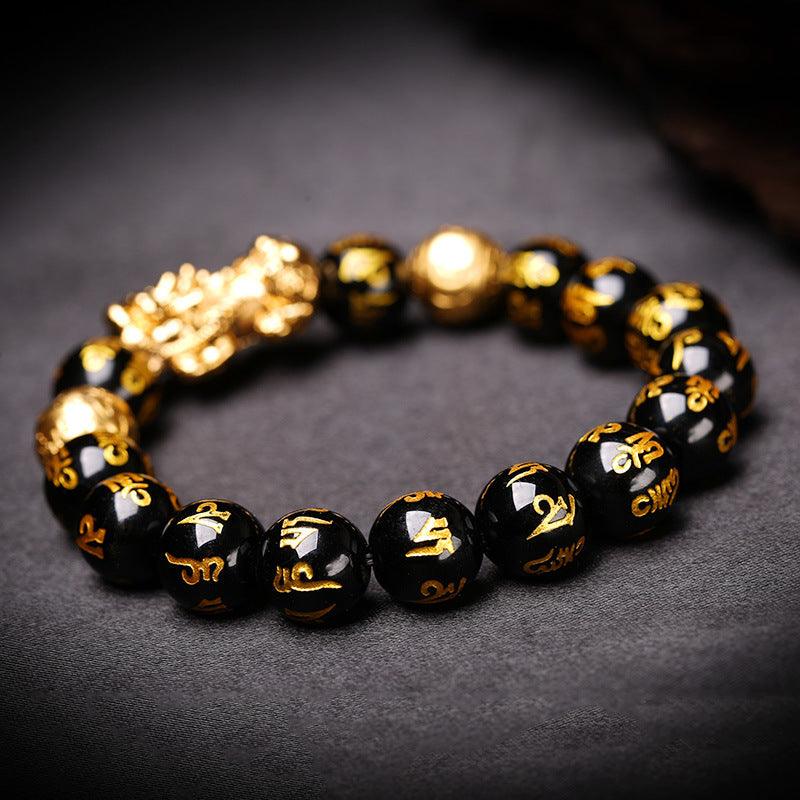 Pixiu charm bracelet with black mantra beads, designed for those seeking strength, protection, and financial success.