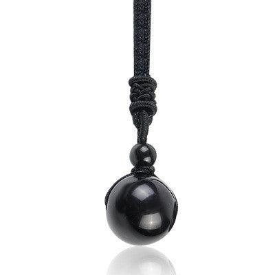 Round black obsidian pendant, symbolizing protection and grounding energy for daily wear.