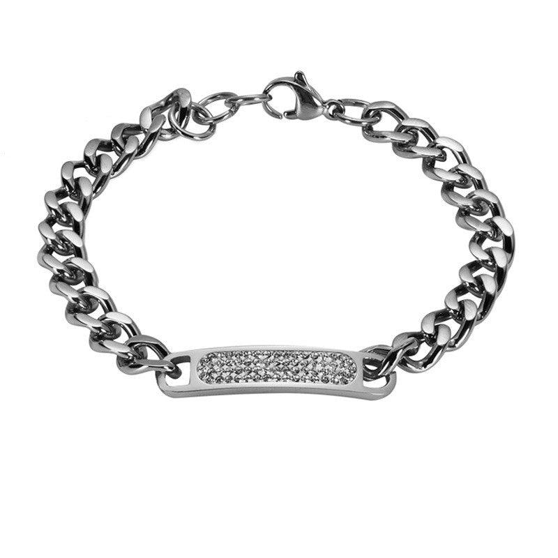 Sleek silver chain bracelet with a crystal-studded bar, adding subtle sparkle to any outfit.
