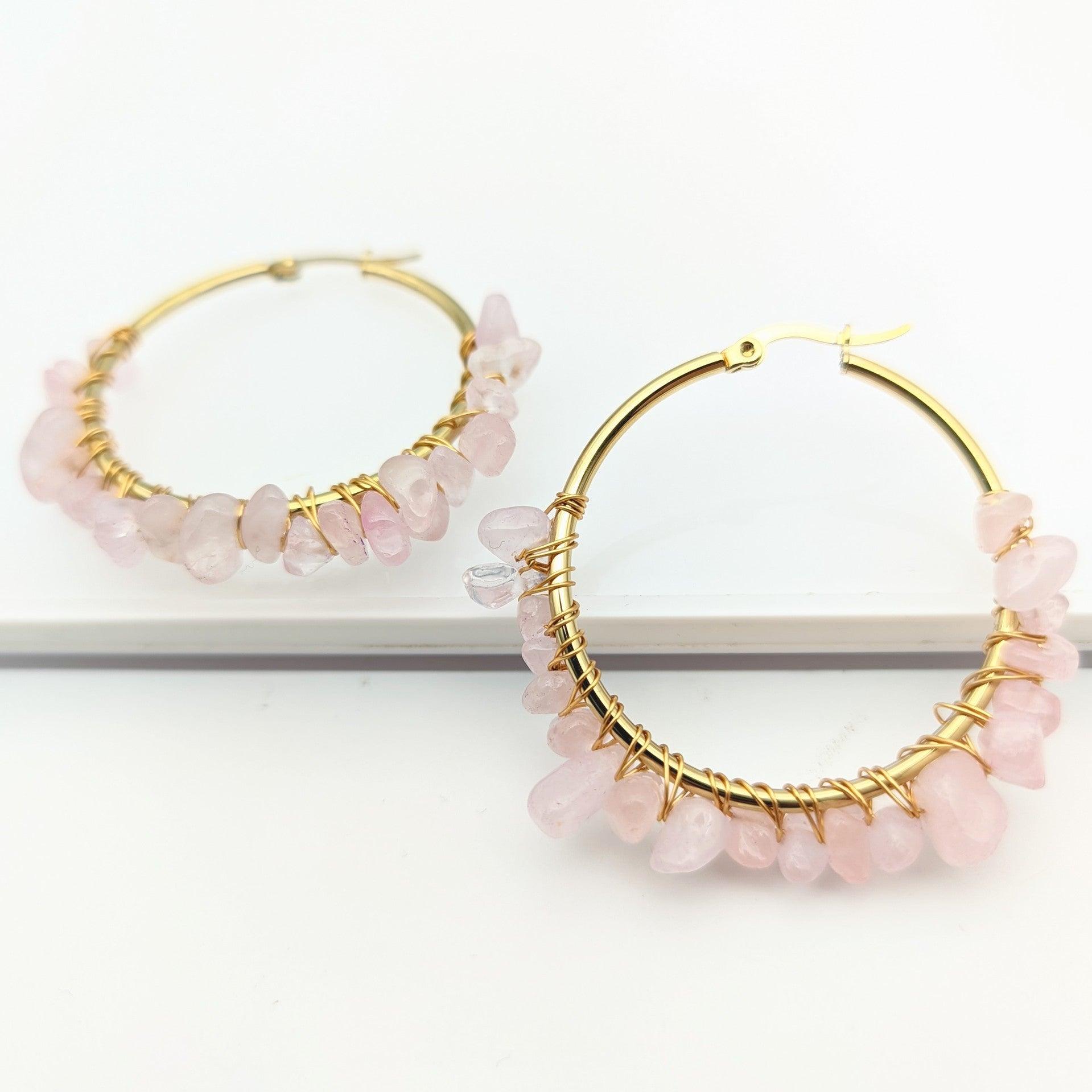 The combination of pink stones and golden earrings creates a sweet, romantic look, symbolizing love and tenderness. Pink stones are often seen as symbols of love, making these earrings ideal for those wishing to enhance relationships and attract romance.