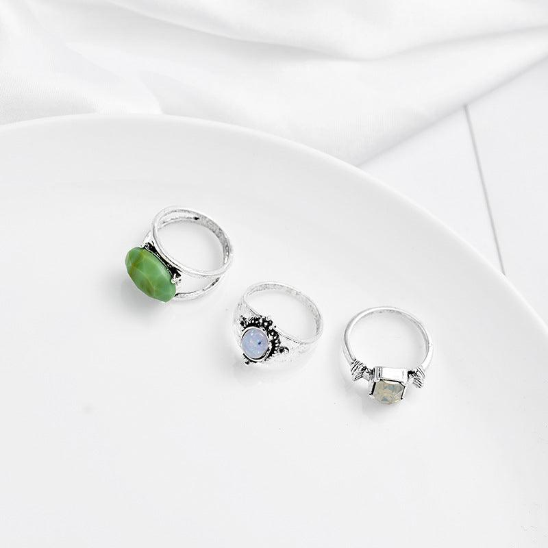 Three silver rings with unique gemstone designs displayed on a white background, highlighting their elegant and vintage-inspired style.