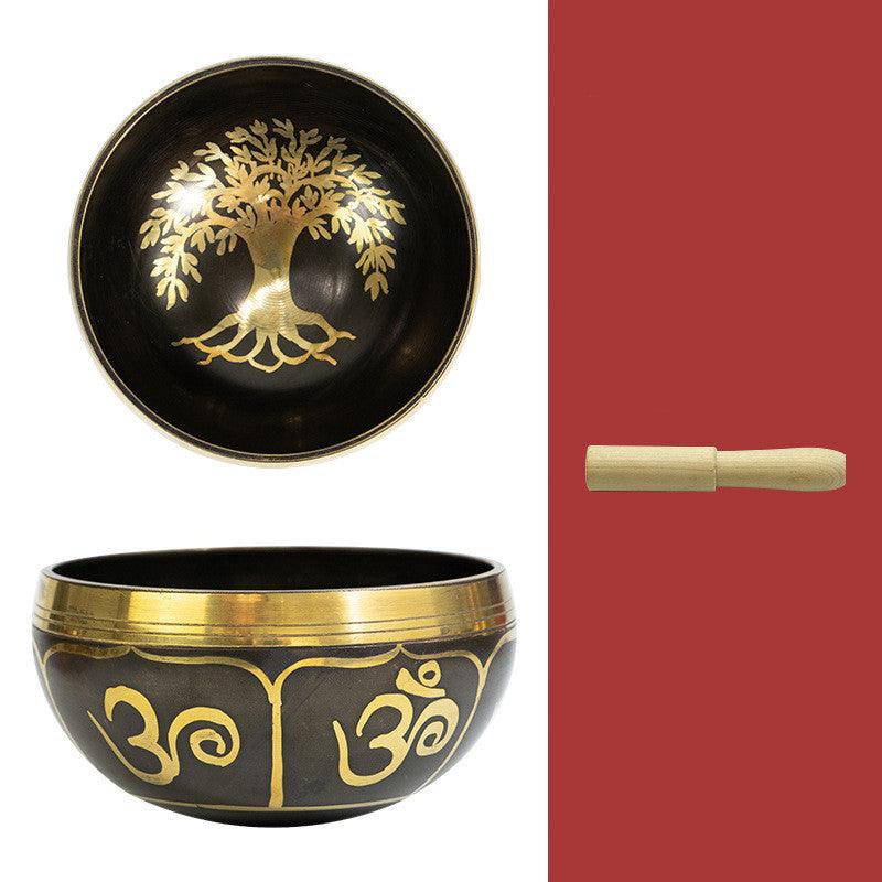 Tibetan singing bowl set with mallet and cushion, often used in spiritual ceremonies to create harmonious sounds that purify spaces.