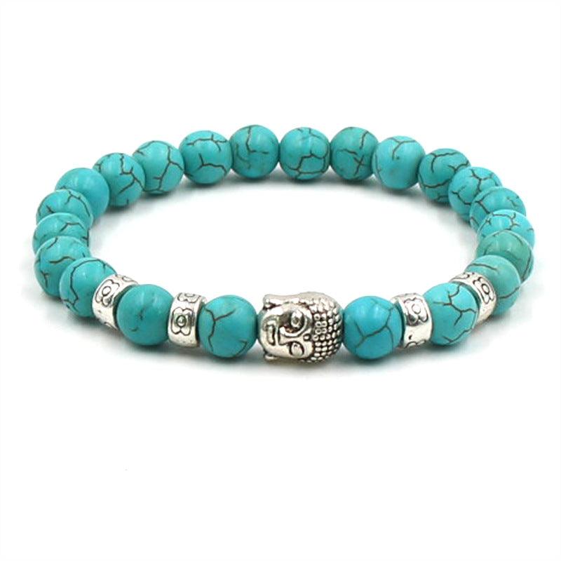 Turquoise crackled Buddha bracelet, a symbol of tranquility and spiritual awareness for the wearer.
