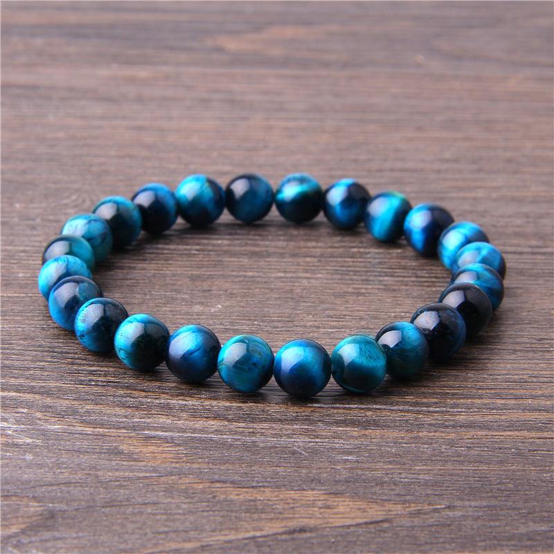 Natural blue tiger's eye gemstone beaded bracelet for protection and focus.