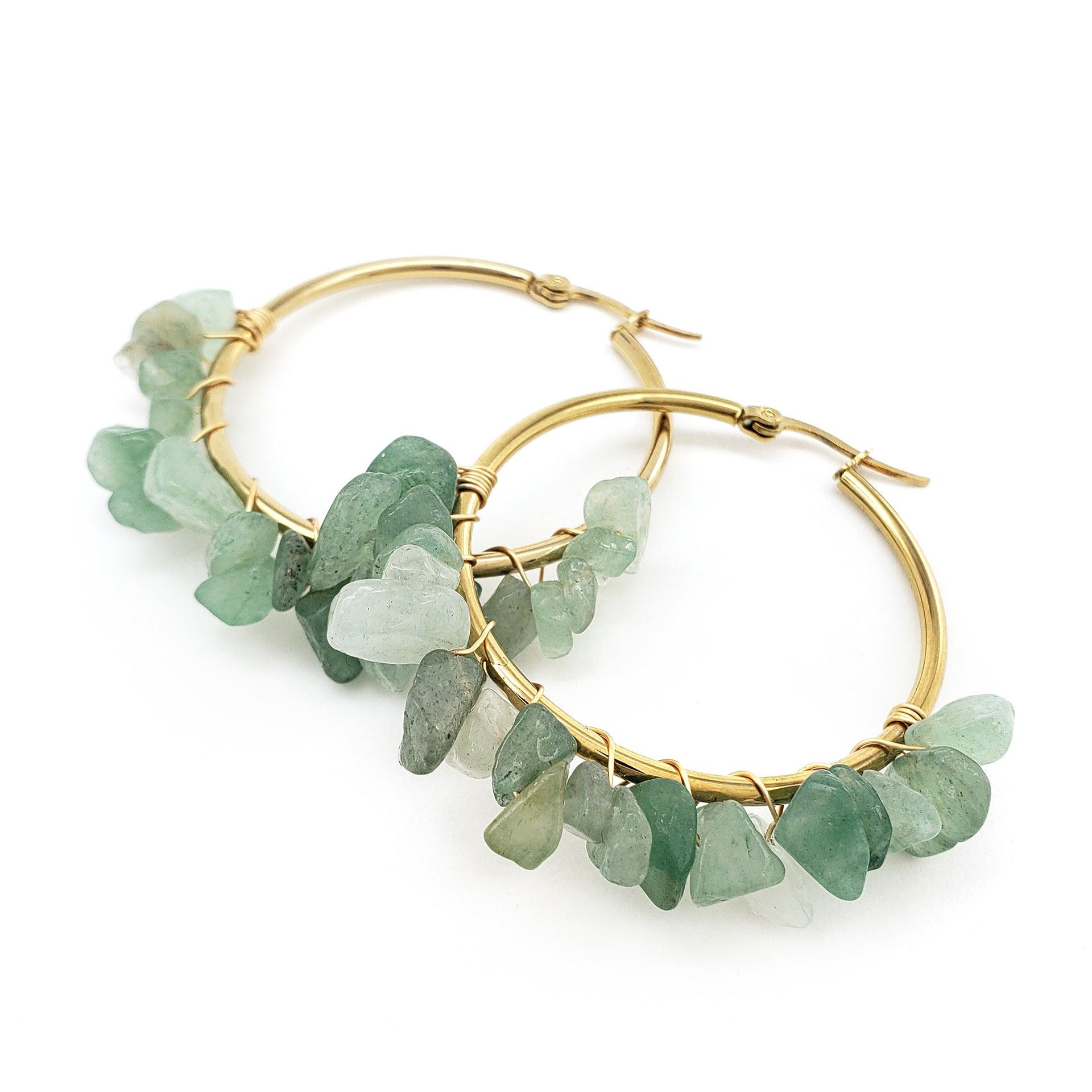 the green stone earrings in this design emit a refreshing natural vibe, symbolizing vitality and hope, ideal for wearers with a love for the outdoors and a distinctive style.