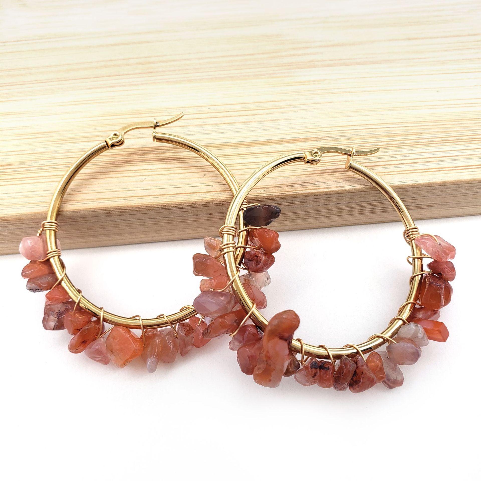 these earrings radiate warmth and energy. Orange stones are commonly associated with confidence and creativity, making them suitable for individuals who wish to express passion and individuality.